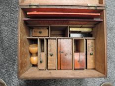 A wooden storage box containing a Compendium of Games including Chess, Solitaire Marbles include