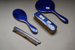 An electric blue guilloche dressing table set, comprising of mirror, brush, comb and smaller