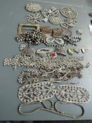 A collection of Art Deco rhinestone buckles,dress clips and more, a very useful collection.