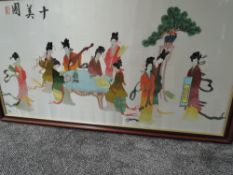 A large vintage Chinese embroidery using silk thread, depicting ten ladies relaxing, reading or