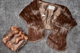 A mink shawl, sold with a mink muff having tails attached.