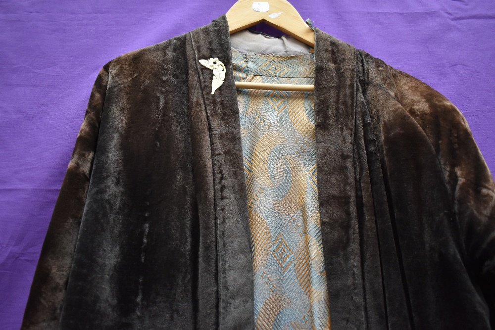 An unusual early 20th century velvet jacket, possibly Oriental, some fade throughout. - Image 2 of 3