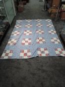 A vintage quilt, around 1940s,having floral pattern to front and patchwork to reverse, Hamilton bra