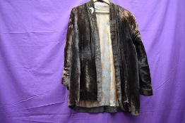 An unusual early 20th century velvet jacket, possibly Oriental, some fade throughout.