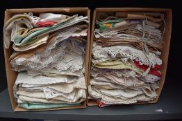 Two boxes of varied vintage and antique table linen.