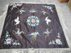 A late 19th / early 20th century double sided silk shawl having deep fringing to edges, plain blue