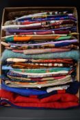 An array of vintage headscarves and neck scarves.