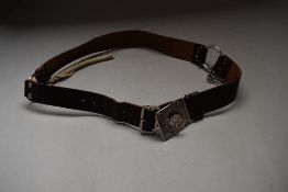 A Girl Guides association leather belt.