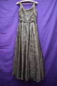 An early 1960s brown Jean Allen evening gown having gathered waist and full skirt and a similar