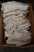 A large collection of vintage and antique white work table linen to include lace edged,cutwork,