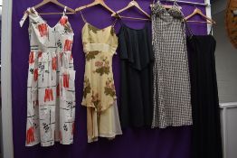 A mixed collection of ladies vintage dresses, predominantly 60s and 70s.