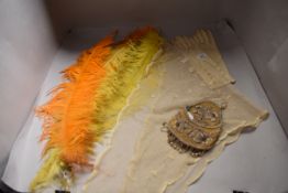 A mixed lot including beaded Victorian coin purse,tulle shawl, gloves and four long dyed feathers.