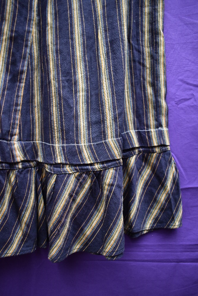 An early 20th century striped cotton skirt or petticoat, in navy, orange, blue and green, appears to - Image 2 of 2