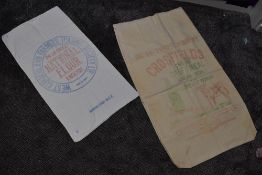 Two advertising sacks,one for Crosfields calf feed and the other National flour.