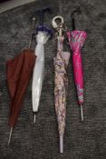 Four interesting vintage umbrellas, including floral with swan shaped handle, pink floral with