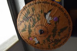 A mid century Oriental paper parasol.