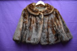 A 1960s chestnut brown mink jacket having 3/4 length sleeves.