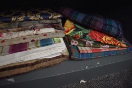 A selection of generous sized fabric remnants to include Laura Ashley upholstery fabric, tartans and