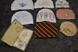 A lovely lot of six early 20th century tea cosies also a boxed tea cosy set,a Doyley case with