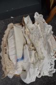 A box full of mixed vintage table linen included are embroidered examples and lace and crotchet