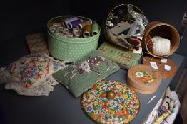 A selection of sewing threads, vintage buttons and haberdashery.