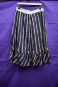 An early 20th century striped cotton skirt or petticoat, in navy, orange, blue and green, appears to