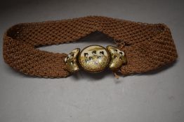 An interesting woven belt having Japanese ceramic Satsuma buckle with silver back.