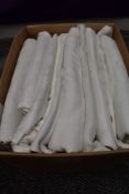 A collection of around ten vintage and antique damask table cloths.