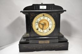A late Victorian cold painted mantel clock having enamel face with bevelled glass door.