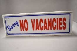 A vintage 'No vacancies' light box.