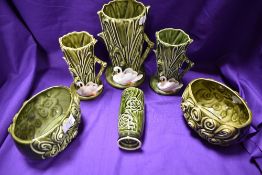 A collection of mid century Sylvac vases and planters, having swans to some and others with stylised