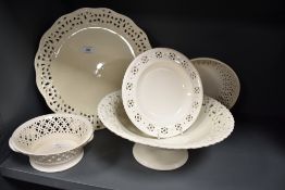 A collection of Leeds ware classical cream ware having simple and effective perforated design,