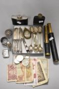 A miscellany of items including hip flasks, collectable coins, vesta case and two brass bodied and