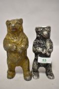 Two circa 1930s cast metal money boxes in the form of bears.
