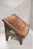 Victorian book or bible rest having a Gothic design carved in mahogany