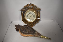 Edwardian fire side bellows in oak having carved details with similar barometer