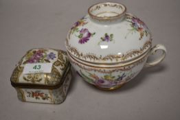 A hand painted porcelain tea cup with lid and strainer, marked Dresden to underside, having floral
