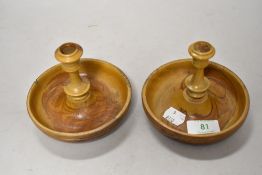 A pair of finely turned candlesticks