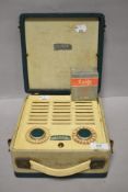A vintage Vidor CN429 portable battery radio with unused old stock battery.