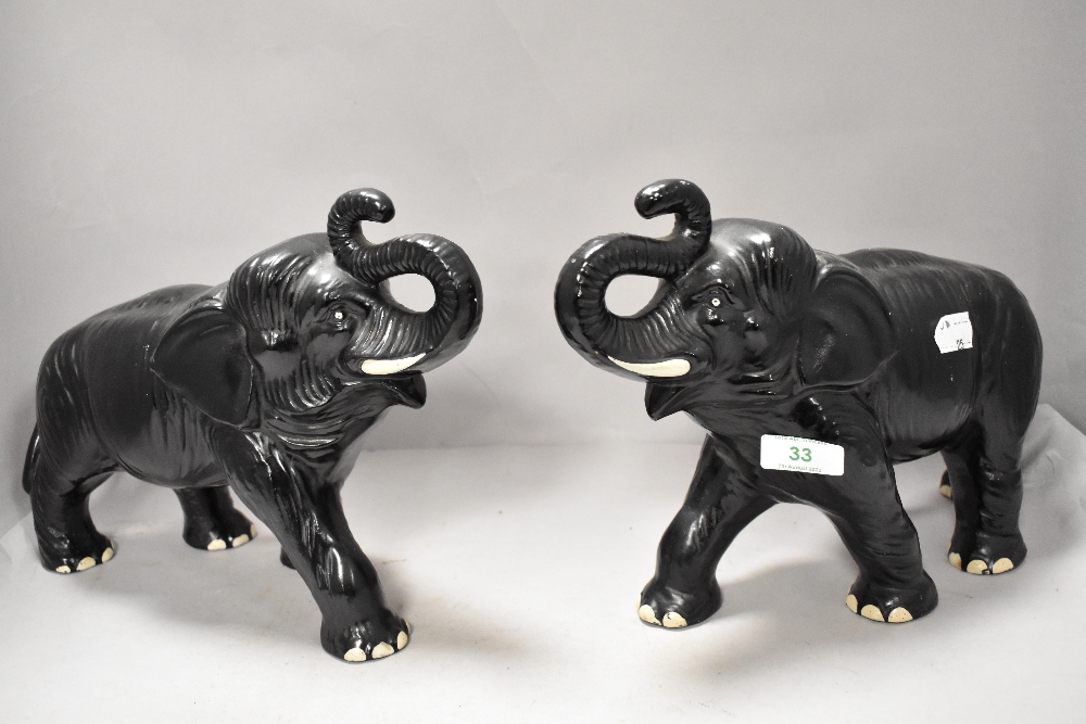 A large pair of 1950s matt black Sylvac elephants impressed with 771 Z made in England.