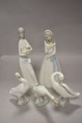 A selection of Lladro and similar figures including ducks/geese and ladies