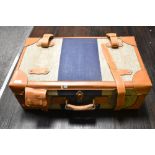 A vintage style suitcase, tweed style and leather finish