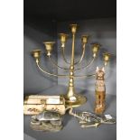 20th century tourist keepsakes including Egyptian stone carved figures and brass Minorah candle
