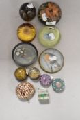 A varied lot of paperweights including colourful millefiori, resin examples with inset flowers, also