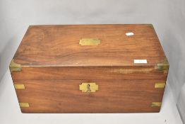A Victorian writing slope of mahogany having brass escutcheon and brackets, key present.