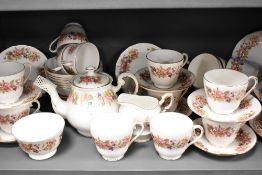 A Colclough bone china 'Wayside' partial tea service, comprising of tea pot, cups and saucers,
