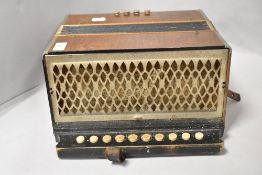 A vintage Hohner accordion having wooden body.