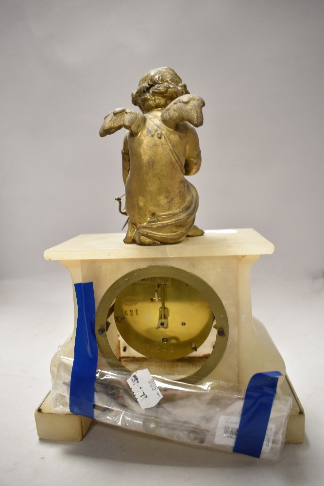 An early 20th century alabaster mantel clock having gilt cherub to top, enamel face and Roman - Image 3 of 6