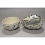 Two items of textured studio pottery in blue and yellow tones on natural ground, both marked KB to