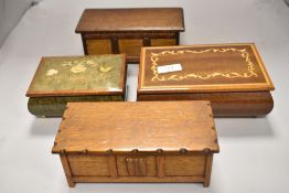 Four vintage jewellery boxes including two modelled as oak kists